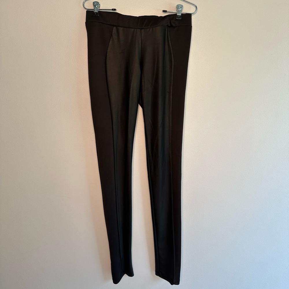 Black faux leather leggings with polyester-spandex side panels.